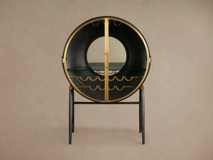 Gideon Bar Cabinet featuring a circular black frame with gold accents, displaying wine bottles on curved gold racks.