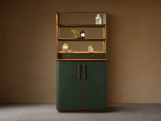 Front view of the Forest Green Grant Bar Cabinet, with dark green upholstered lower doors, brass pulls, wood accents, and mirrored shelves.