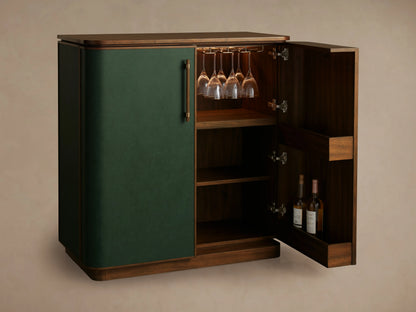 Grant Bar cabinet with walnut wood and green faux leather finish, open door revealing shelves, stemware, and bottle storage inside.