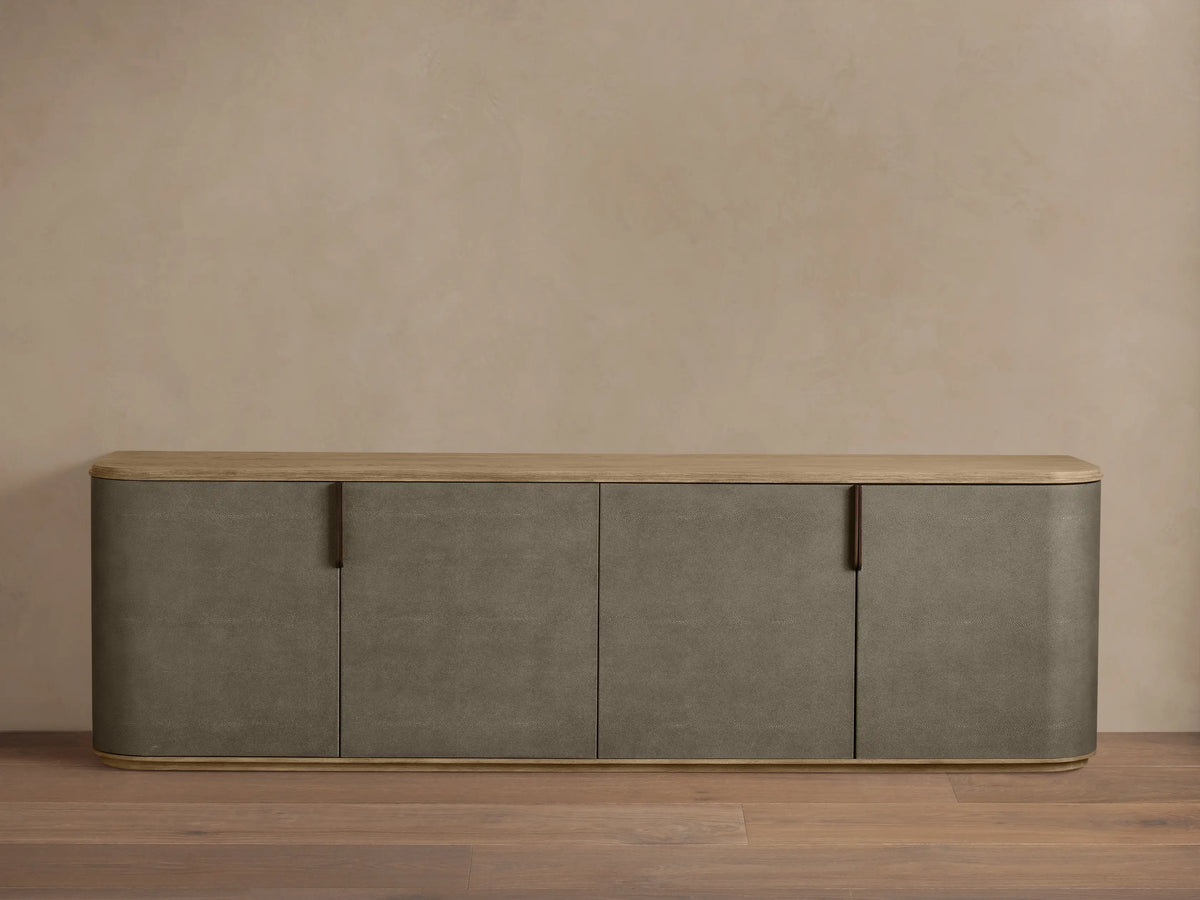Harrow Media Console: Gray-brown faux shagreen console with light oak top, rounded corners, 4 doors, and bronze handles.