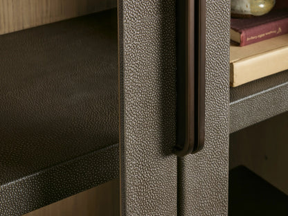Harrow Cabinet: tall, rectangular, gray-brown wood cabinet with rounded edges, two glass doors, dark handle, and four shelves.