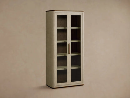 Close-up of Harrow Cabinet interior, showing beige faux shagreen shelves, oak wood back, bronze handle, marble box, & ceramic items.