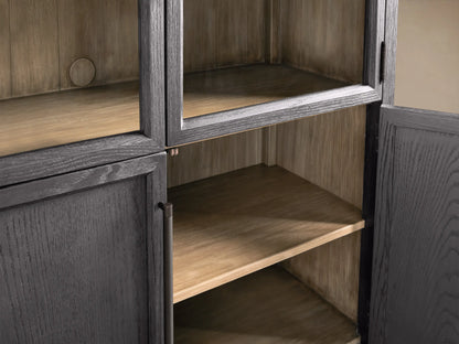 Front view of the black Hattie Glass Cabinet with arched top, glass doors, reeded hardware, brass-capped feet, and light shiplap interior.