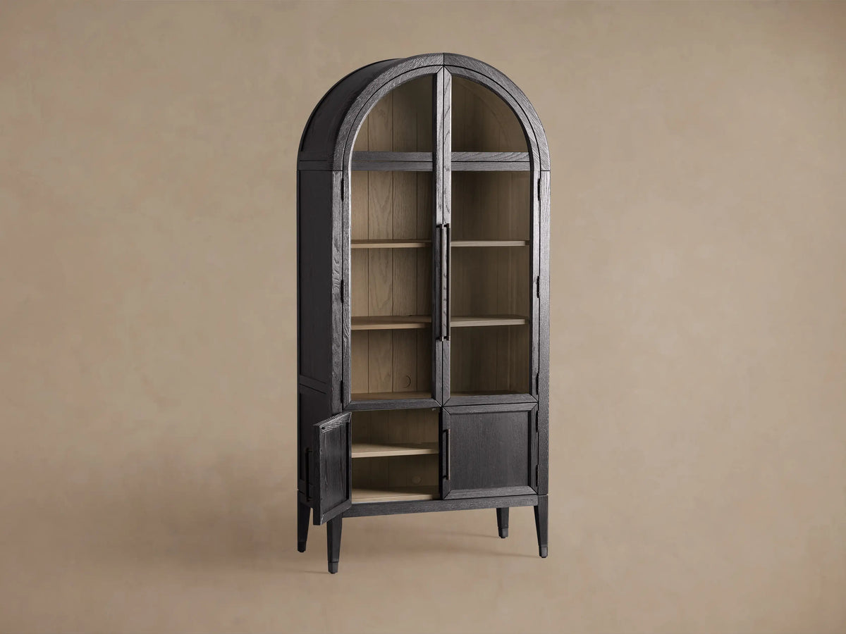Close-up of the Hattie Glass Cabinet with dark gray frame and open glass door, revealing natural wood shelves and shiplap back.