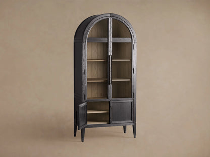Close-up of the Hattie Glass Cabinet with dark gray frame and open glass door, revealing natural wood shelves and shiplap back.