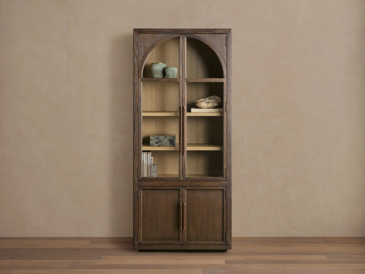 Hattie Squared Glass Cabinet, dark brown oak. Arched glass top doors, solid bottom doors, light interior shelves, reeded hardware.