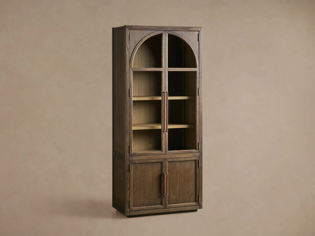 Hattie Squared Glass Cabinet, dark brown oak. Arched glass top doors, solid bottom doors, light interior shelves, reeded hardware.