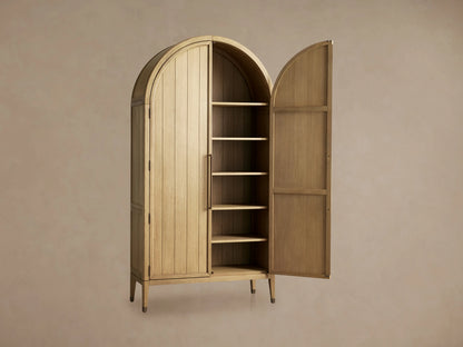 Hattie Cabinet close-up showing its solid oak wood with visible grain, adjustable shelves, and reeded hardware on the door.