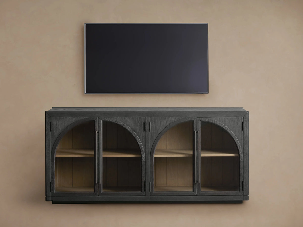 Hattie Sideboard detail showing two dark-stained wood doors with arched design, handles, and visible light wood interior shelves.