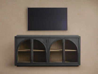 Hattie Sideboard detail showing two dark-stained wood doors with arched design, handles, and visible light wood interior shelves.