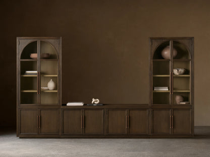Hattie Glass Media Cabinet: A long, dark brown wood media system with two tall arched glass-door cabinets and lower solid wood cabinets.