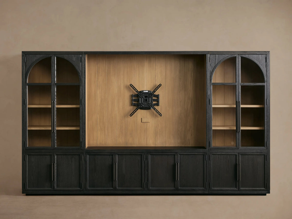 Close-up of the Black Hattie Wall Unit. Lower door open to light shiplap interior. Glass door reveals a white vase on a shelf.