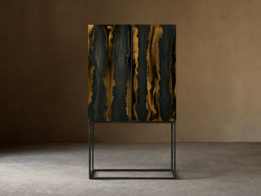 Mareta Bar Cabinet with black and gold marbled vertical wave patterns on doors, standing on a sleek metal base against a neutral wall.