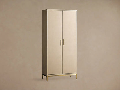 Malone Cabinet: Upright, two light beige doors with textured shagreen, dark trim, brass handles & base on a wooden floor.