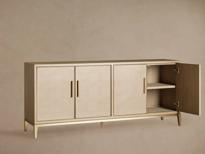 Malone Sideboard's light oak veneer interior, showing two shelves, cable holes, an open door with hinge, and a brass base.