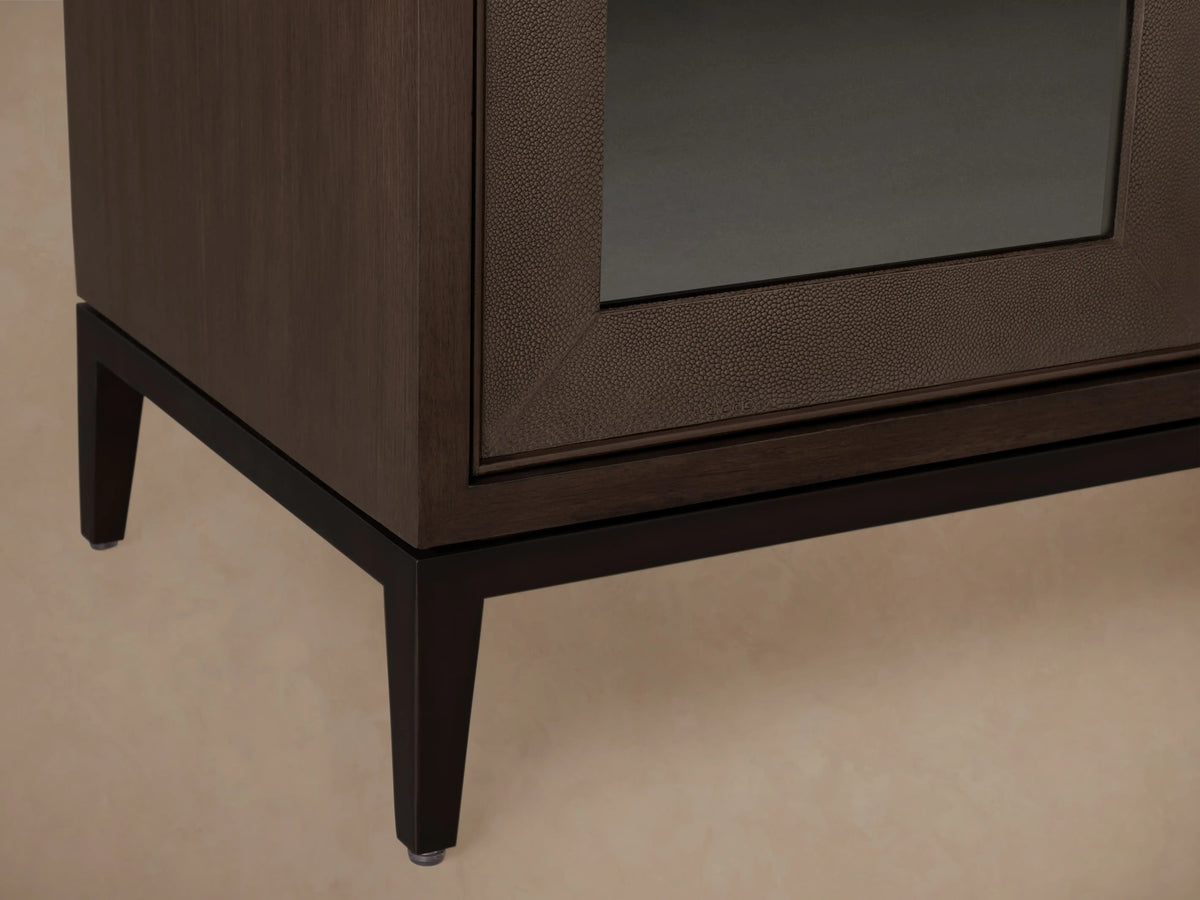 Dark Walnut Malone Sideboard with 4 glass doors, 3 closed, 1 open revealing interior shelves, and a black metal base.
