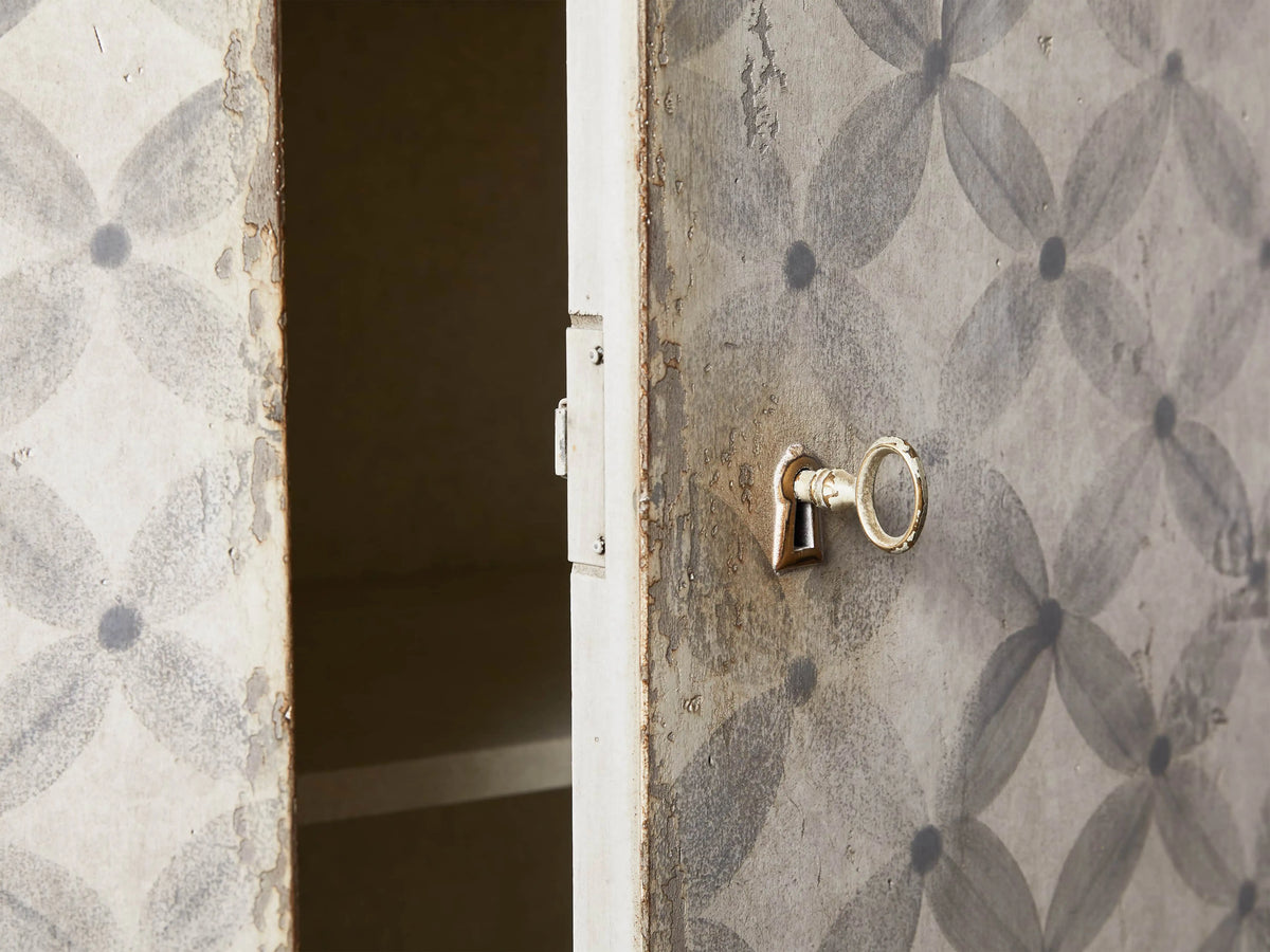 Close-up of Messina Margherita Bell'Arte Buffet, distressed antique white, open drawer, dark knob, gray floral pattern.