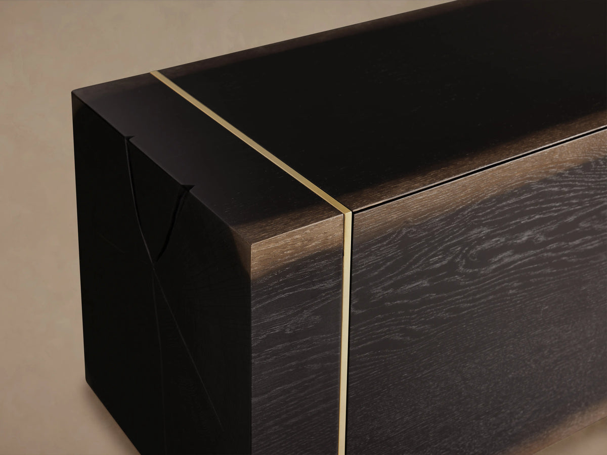 Mihaela Media Console with dark brown wood grain, gold metal trim, and subtle hand-carved detailing on the edges.