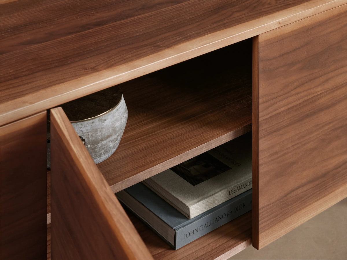 Mihaela Media Console, walnut wood, floating style, with one door open revealing two shelves, two closed doors, and dark metal legs.