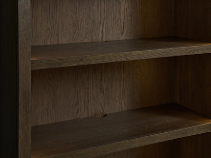 Close-up of the Nason Modular Hutch Cabinet's interior, showing two dark brown mocha-finished oak shelves with visible wood grain.