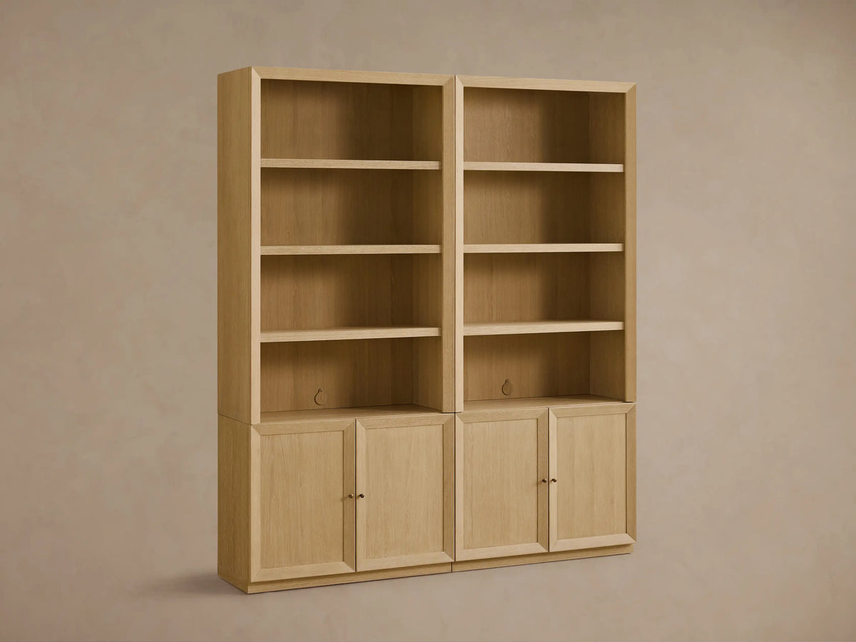 Two Nason Modular Hutch Cabinets, light white oak. Each unit has open shelves above a two-door cabinet with aged nickel pulls. Cord management holes.