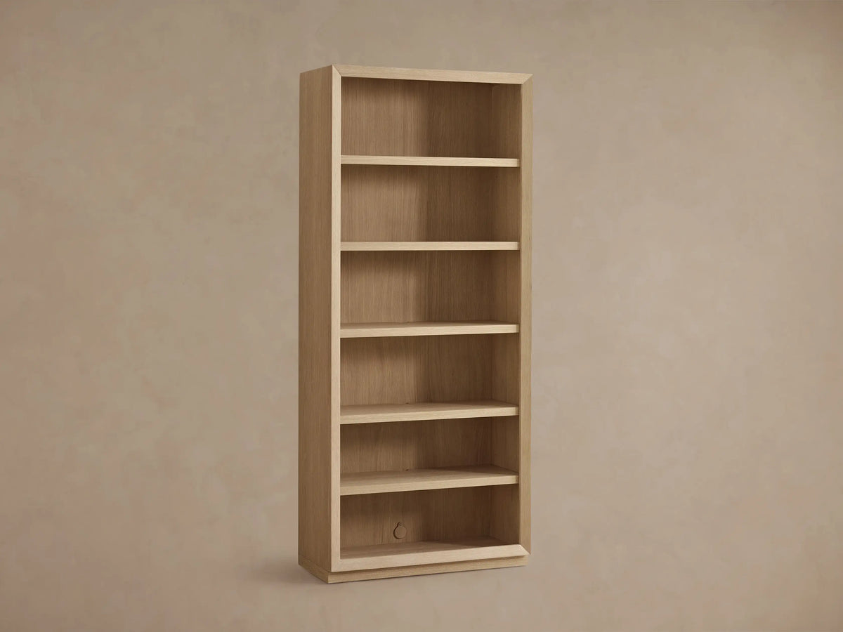 Close-up of Nason Modular Bookcase shelf, light white oak with grain, glowing recessed LED side lighting.