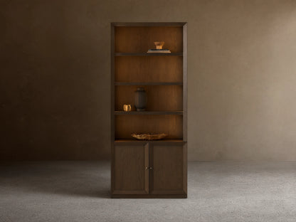 Dark mocha Nason Modular Hutch Cabinet, open shelves with decor, two closed doors with aged nickel pulls.