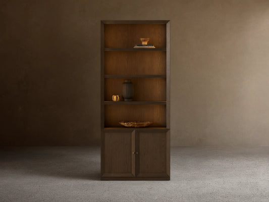Dark mocha Nason Modular Hutch Cabinet, open shelves with decor, two closed doors with aged nickel pulls.