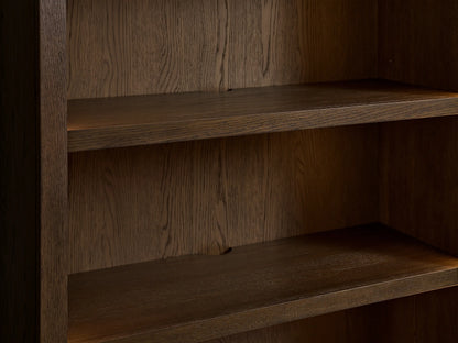 Nason Modular Hutch Cabinet. Close-up of interior with two dark mocha oak shelves, visible wood grain, and soft internal light.