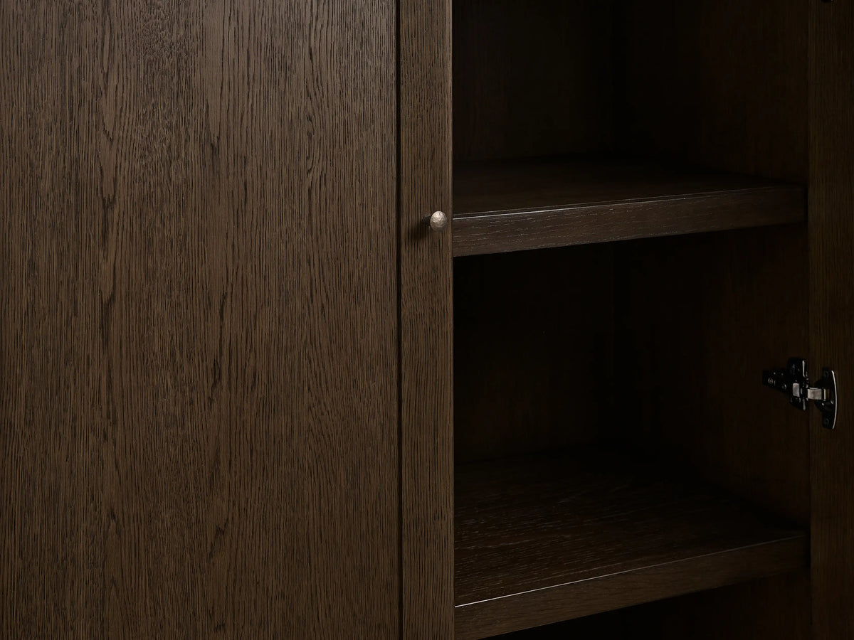 Nason Modular Hutch Cabinet in Mocha red oak. Close-up of left door with aged nickel knob, right open showing dark shelves.