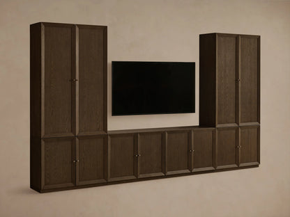 Mocha finished Nason Modular Media Cabinet Set. Dark oak units with framed doors, some open revealing shelves and decor, flanking a TV.