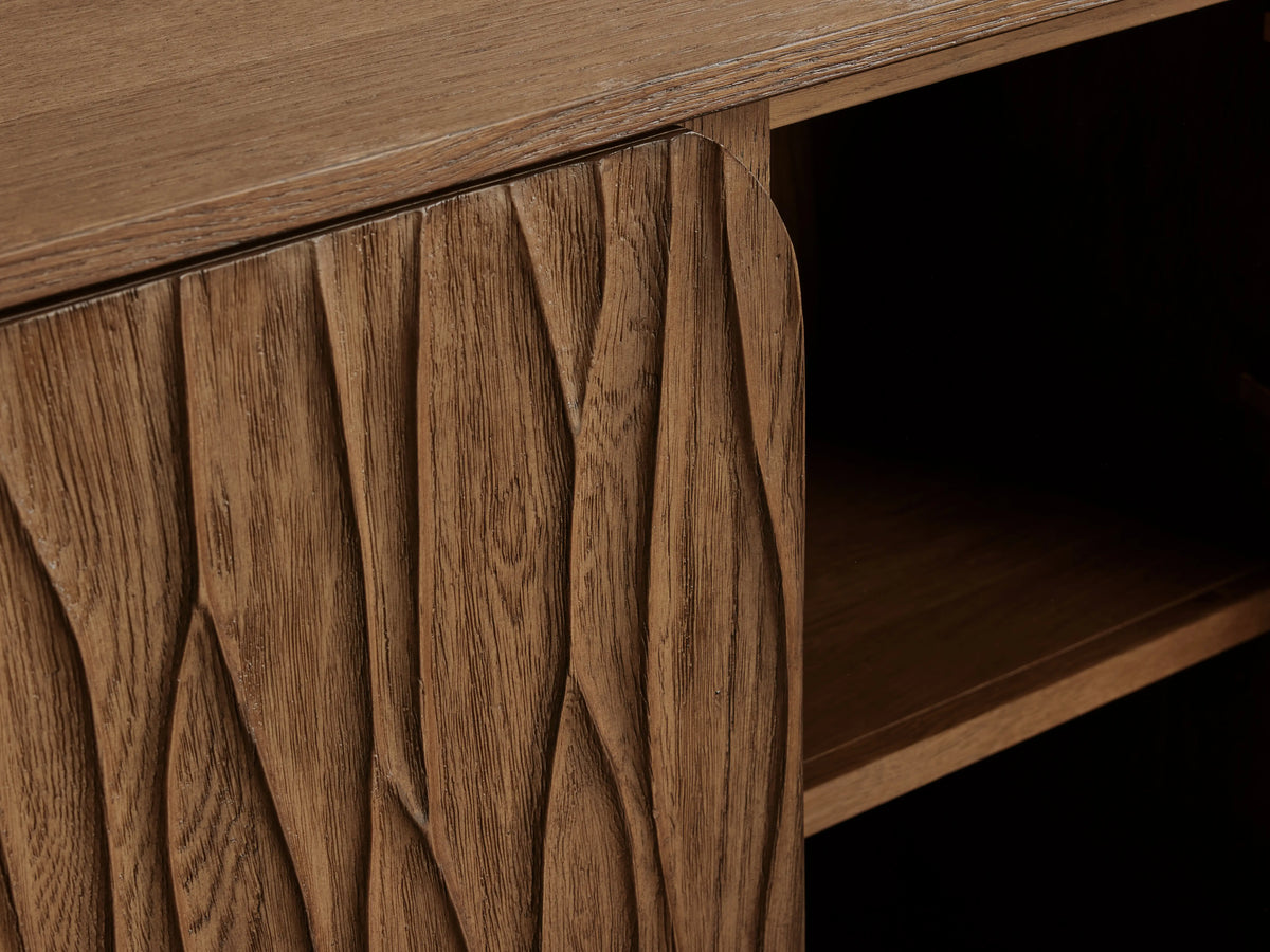 Norris Sideboard: Close-up of its carved wood-grain fiberglass door, slightly open, revealing a dark interior and shelf.