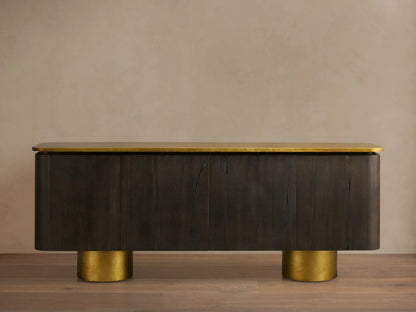 Neira Buffet crafted from Mexican walnut wood with a dark ash finish, features aged brass legs and top; four-door design.