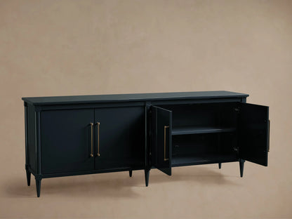 Oakleigh Sideboard made of dark wood with brass hardware, two doors open to show one adjustable shelf, on tapered legs.