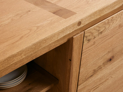 Panta Sideboard in natural wood finish featuring a minimalist rectangular design with angled legs and smooth surface.