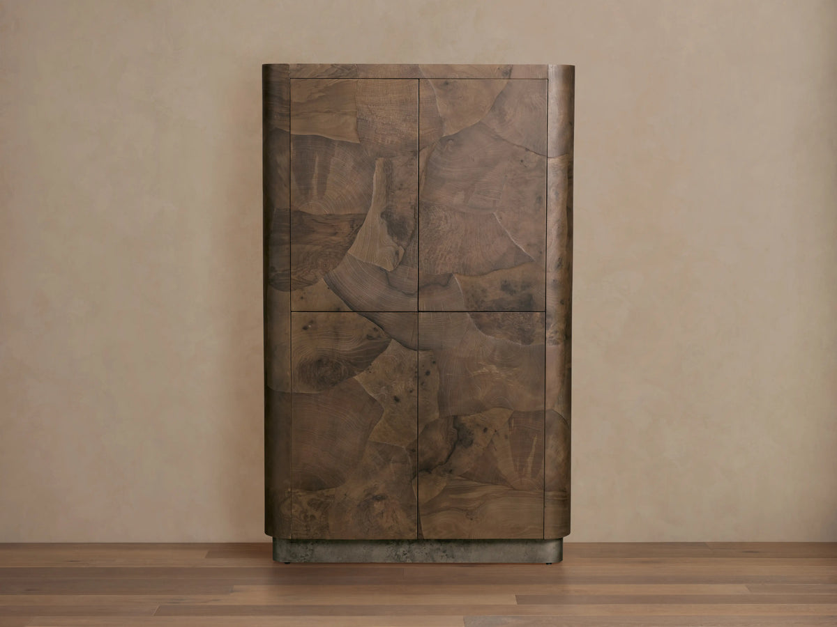Polanco Cabinet in natural wood finish, showcasing oyster-cut patterns and unique graining. Stands on weathered steel base.