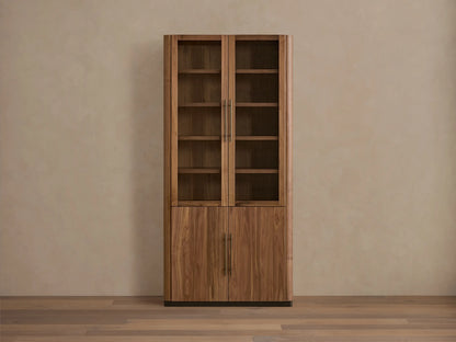 Piermont Modular Glass Cabinet. Dark walnut, two glass doors above two wood doors, bronze handles and base, on a light wood floor.