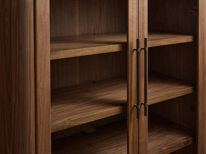 Piermont Modular Glass Media Cabinet: dark walnut, right sliding door slightly open, revealing shelves & cord hole. Bronze handle, dark top.