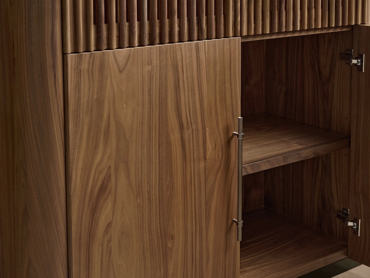Tall dark walnut Piermont Modular Reeded Cabinet with reeded upper doors, solid lower doors, and a bronze plinth base.