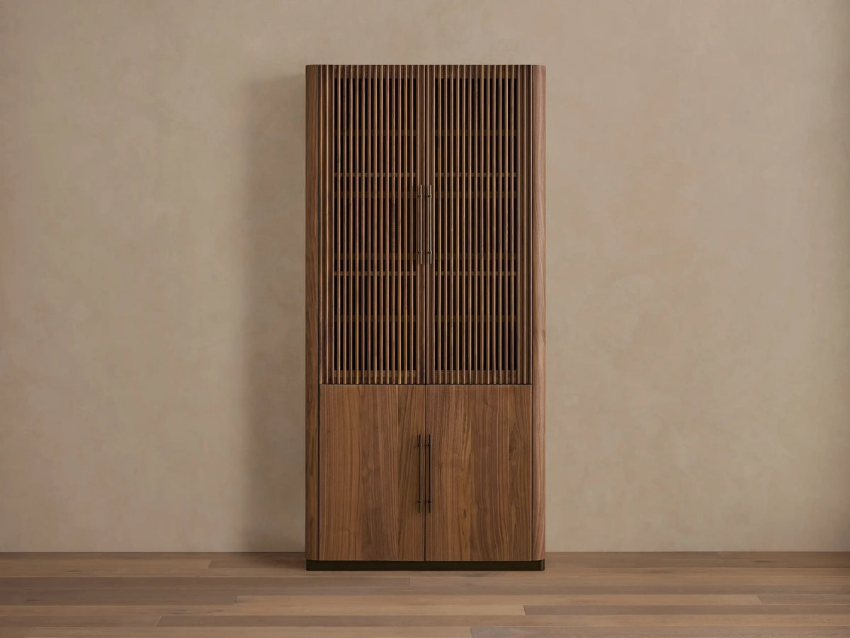 Piermont Modular Reeded Cabinet. Close-up of rich walnut reeded door, bronze handle, and interior shelves.