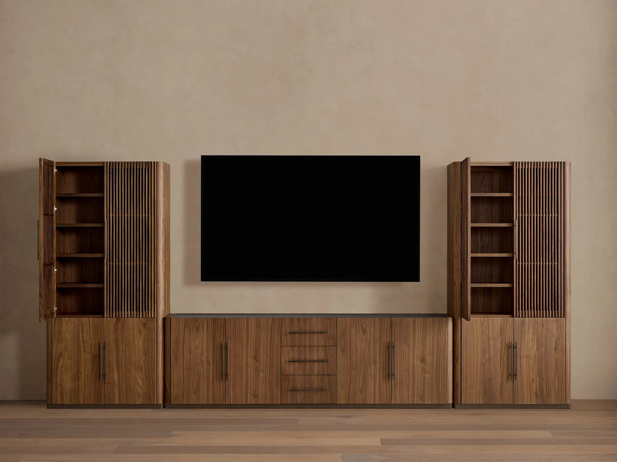 Piermont Modular Reeded Media Cabinet Set in walnut. Full view of side cabinets with open reeded doors, central console with drawers.