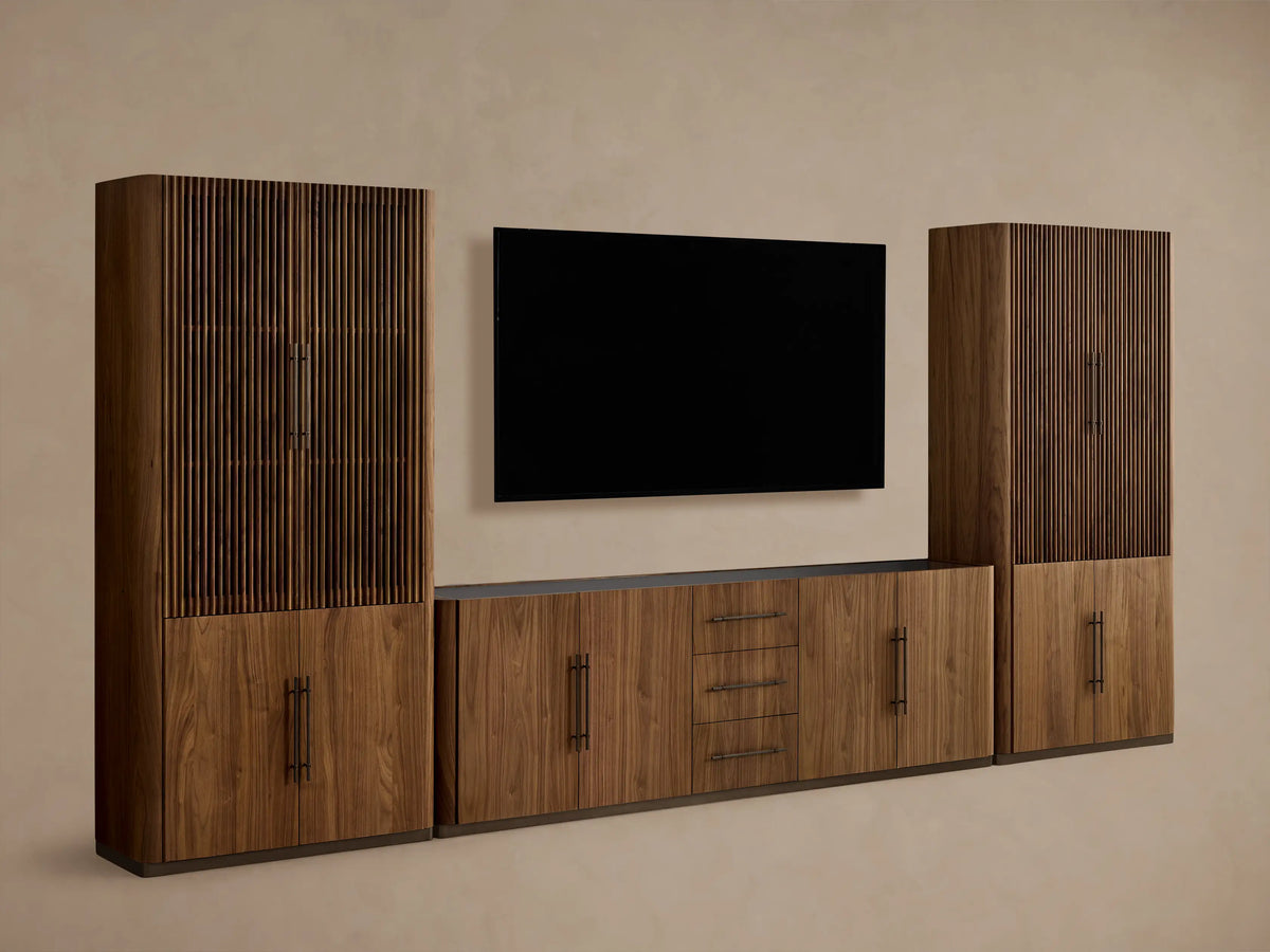 Piermont Modular Reeded Media Cabinet Set in walnut. Full view of side cabinets with open reeded doors, central console with drawers.
