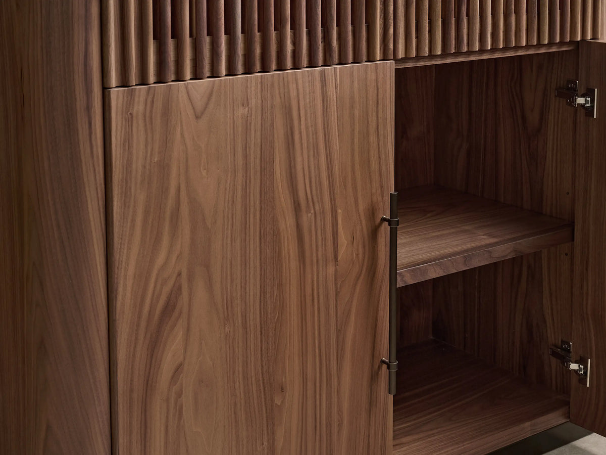 Piermont Modular Reeded Media Cabinet Set in dark walnut, featuring a central TV, reeded upper doors, and bronze plinth base.