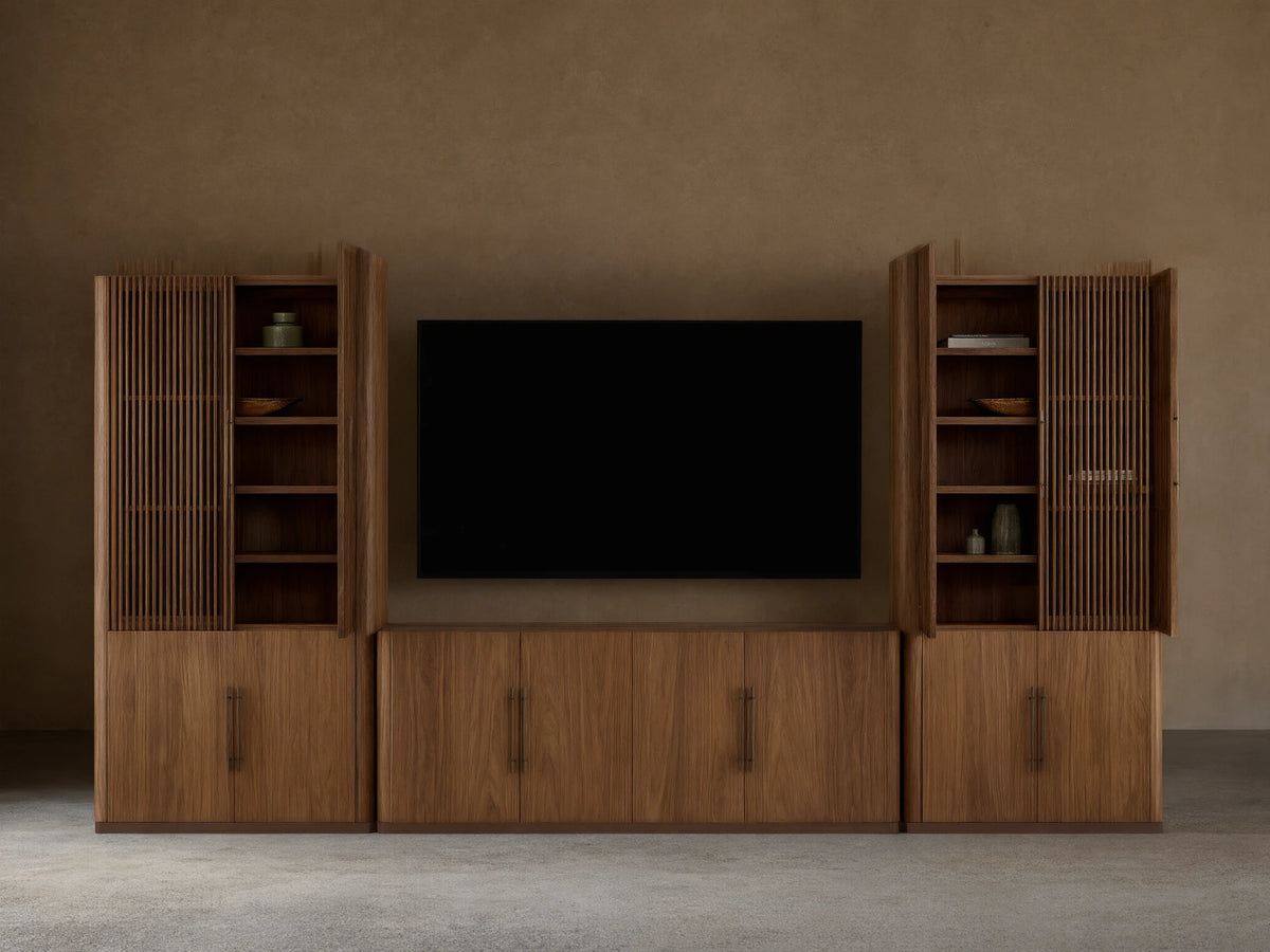 Piermont Modular Reeded Media Cabinet Set: Dark walnut wood set, central media console with black TV, two tall side cabinets with reeded doors ajar.