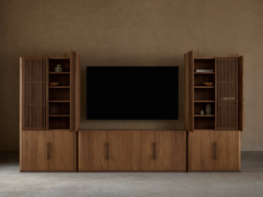 Piermont Modular Reeded Media Cabinet Set: Dark walnut wood set, central media console with black TV, two tall side cabinets with reeded doors ajar.