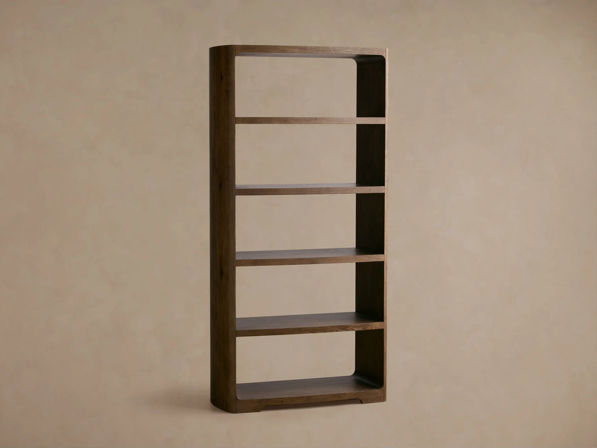 Front view of the dark brown Redding Bookcase, with rounded edges and four fixed, open shelves.