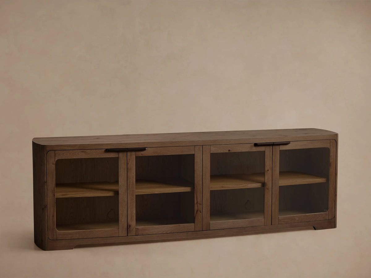 Front view of the dark brown Wooden Media Console with four glass doors, brass handles, and internal shelves.