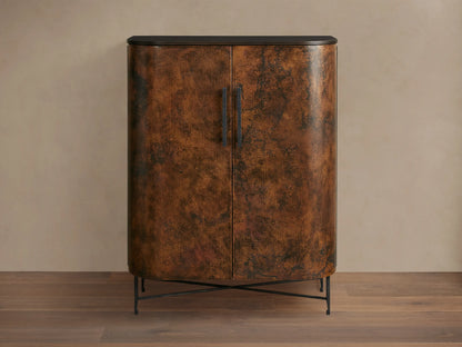 Ruiz Bar Cabinet: Curved, two-door cabinet with fiery orange-brown hand-hammered copper doors, black handles, dark top, and iron base.