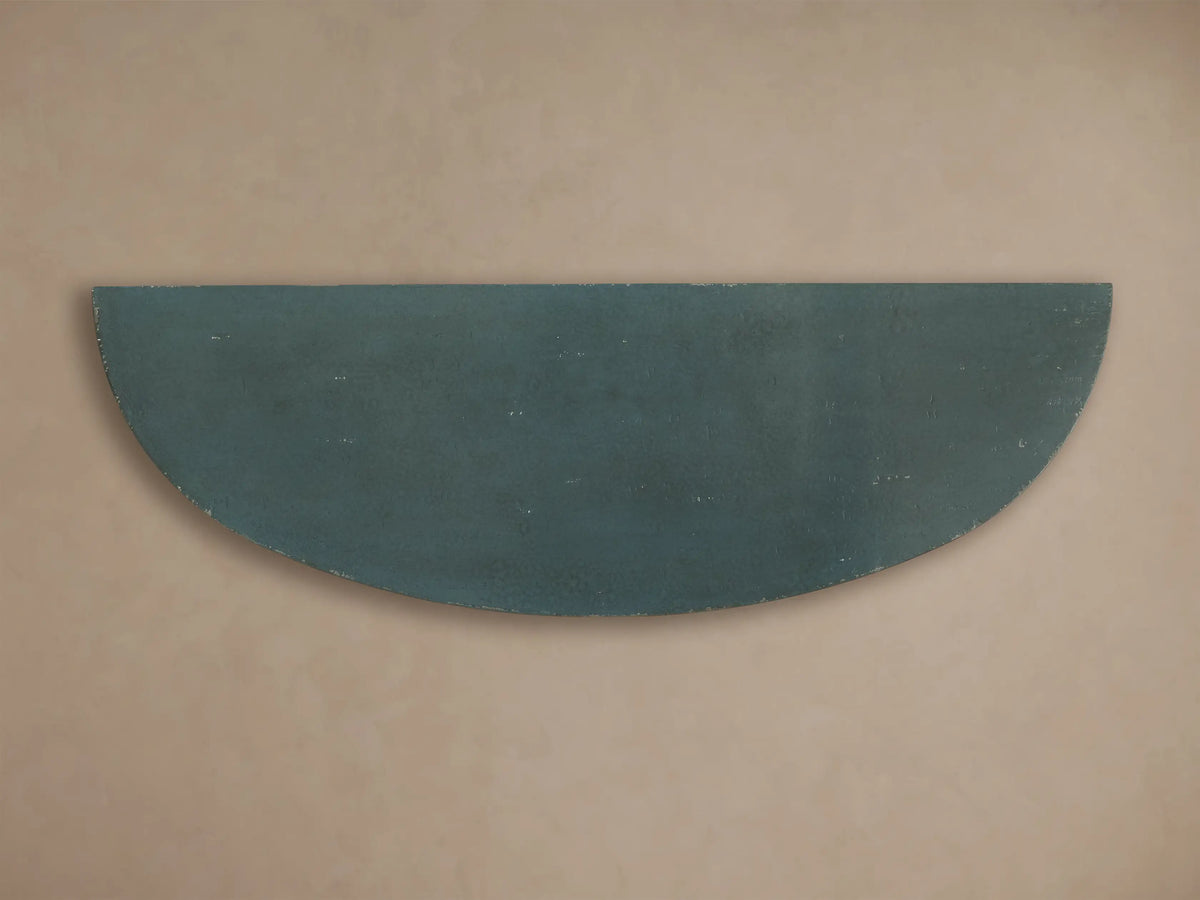 Front view of the distressed dark teal semi-circular surface of the Sofia Bell'Arte Demilune Cabinet.