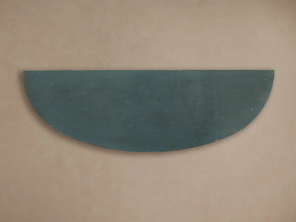 Front view of the distressed dark teal semi-circular surface of the Sofia Bell'Arte Demilune Cabinet.